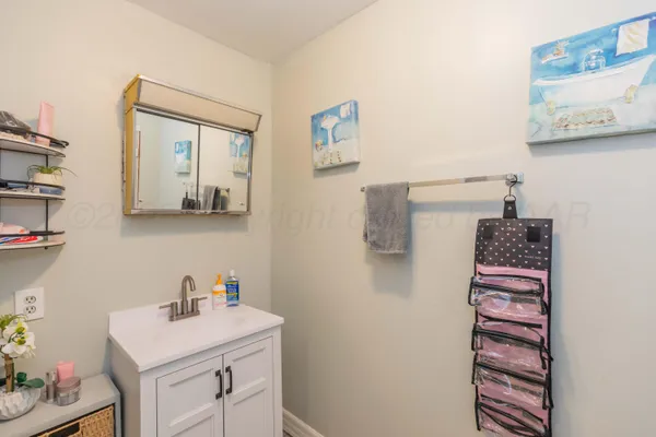 a bedroom with a bed a desk and chair