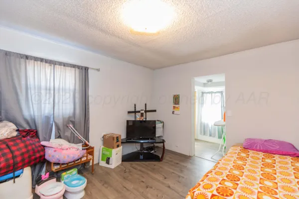 a bedroom with bed and a window