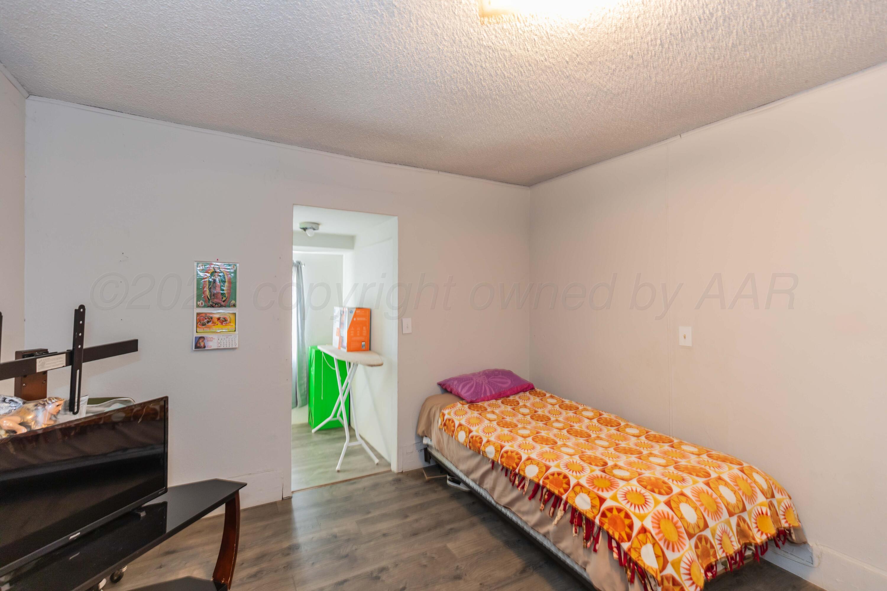 905 North Travis Street Amarillo, TX 79107 - Photo 32 of 42 a bedroom with bed and a window