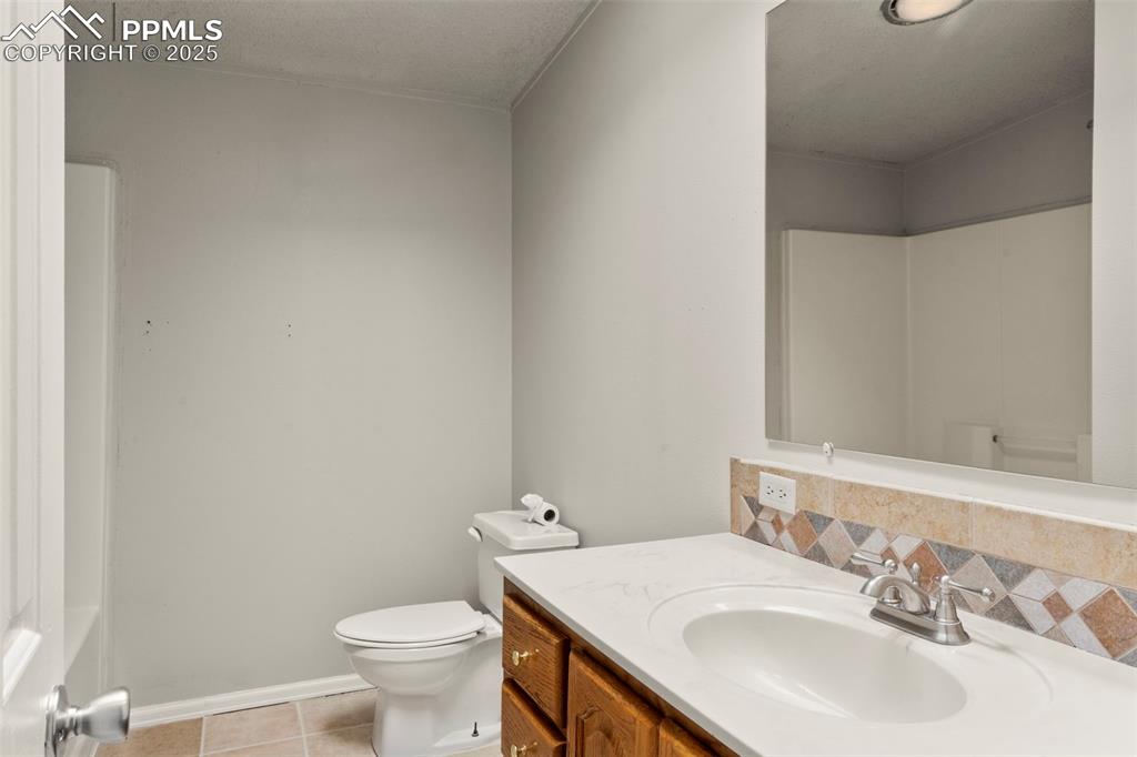 34535 Big Springs Road Yoder, CO 80864 - Photo 19 of 34 a bathroom with a sink and a toilet