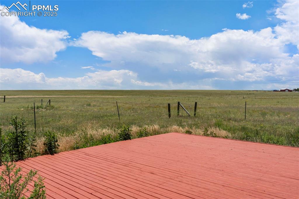 34535 Big Springs Road Yoder, CO 80864 - Photo 22 of 34 a view of a lake with a yard