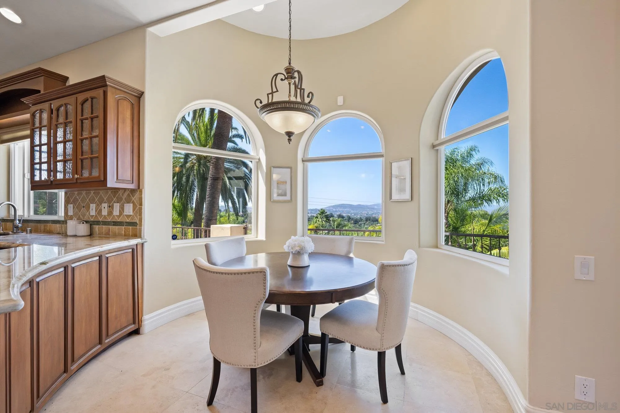 16110 Lakeview Road Poway, CA 92064 - Photo 15 of 51 a dining room with furniture a window and a chandelier