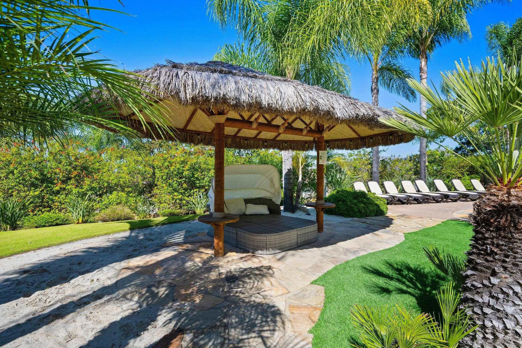 16110 Lakeview Road Poway, CA 92064 - Photo 40 of 51 a view of a patio with table and chairs under an umbrella