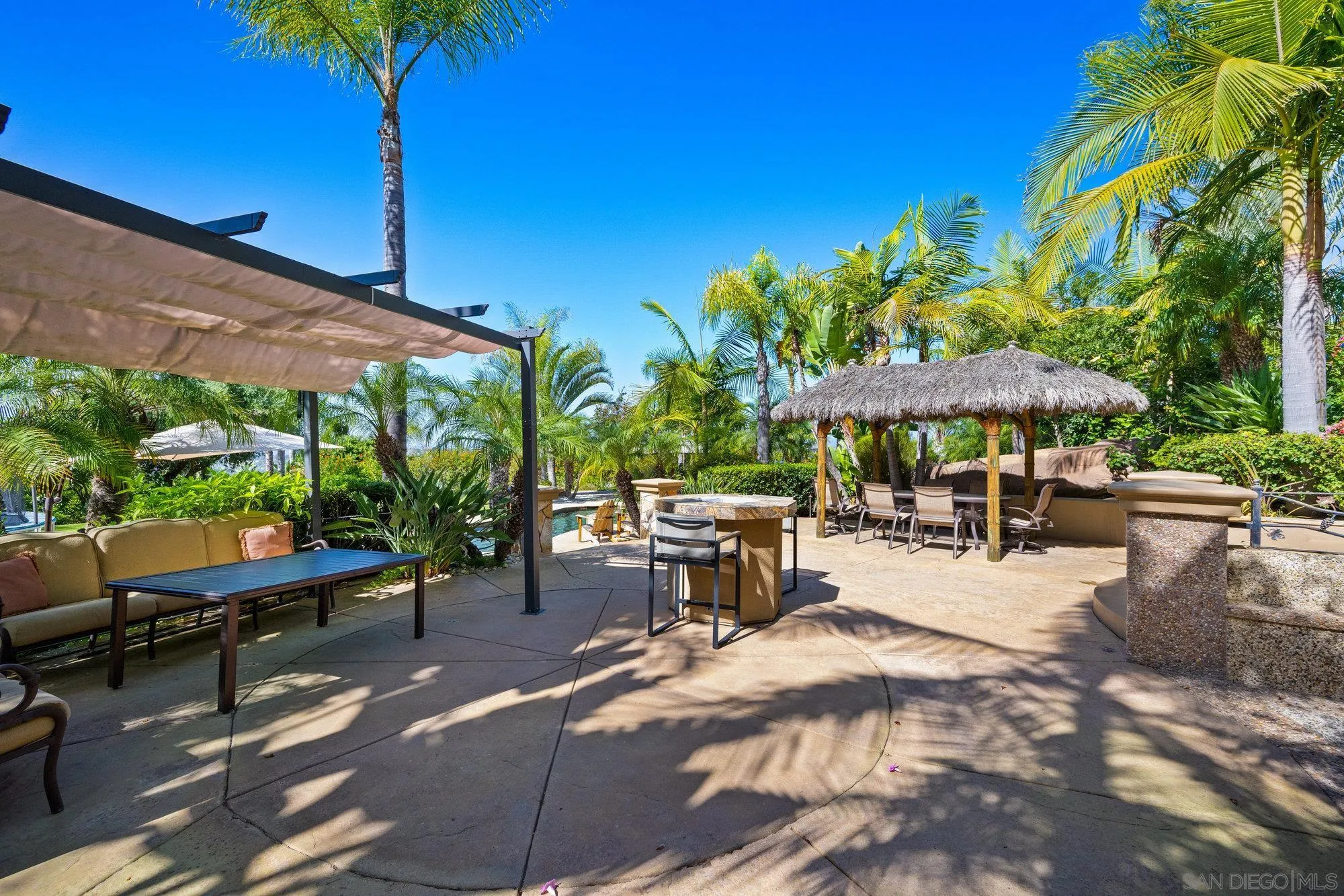 16110 Lakeview Road Poway, CA 92064 - Photo 44 of 51 a view of a patio with a table and chairs under an umbrella