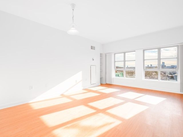 a view of an empty room with a window