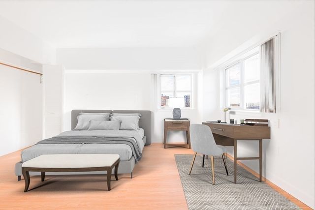 a bedroom with a bed and a table