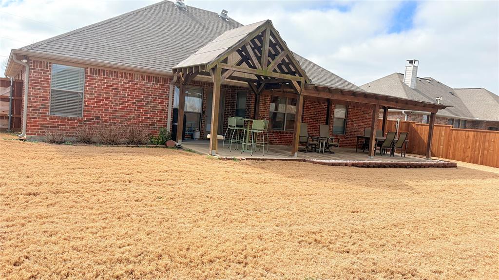 312 McAfee Street Mabank, TX 75147 - Photo 8 of 40 a view of a house with large windows