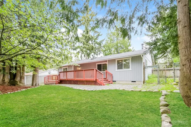 a backyard of a house with seating space