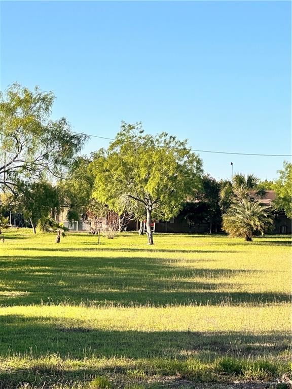 26841 Iowa Gardens Road San Benito, TX 78586 - Photo 2 of 10 Surrounding community with a lawn