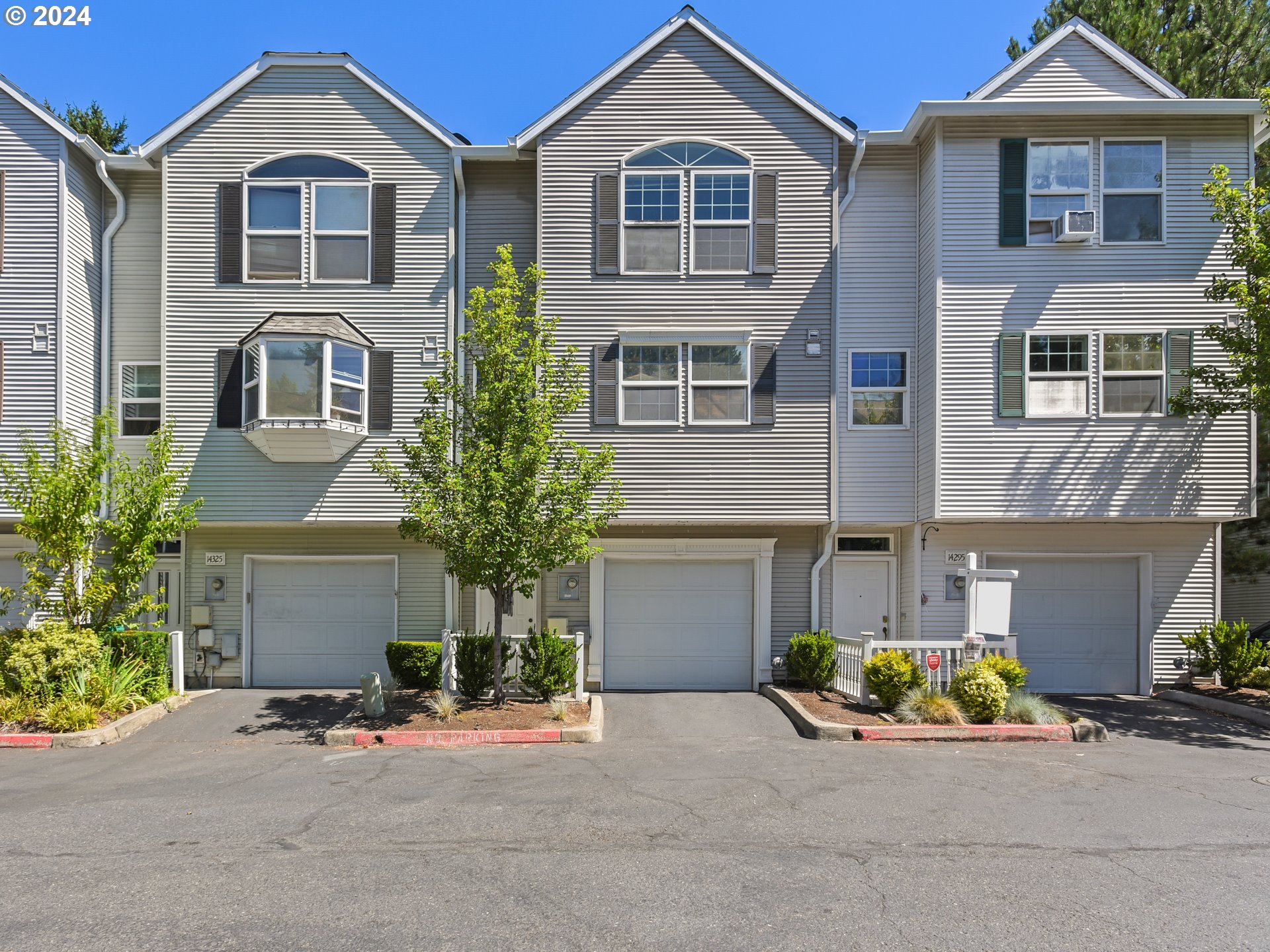 14315 Southwest Cougar Ridge Drive Beaverton, OR 97008 - Photo 1 of 21 front view of a house with a yard