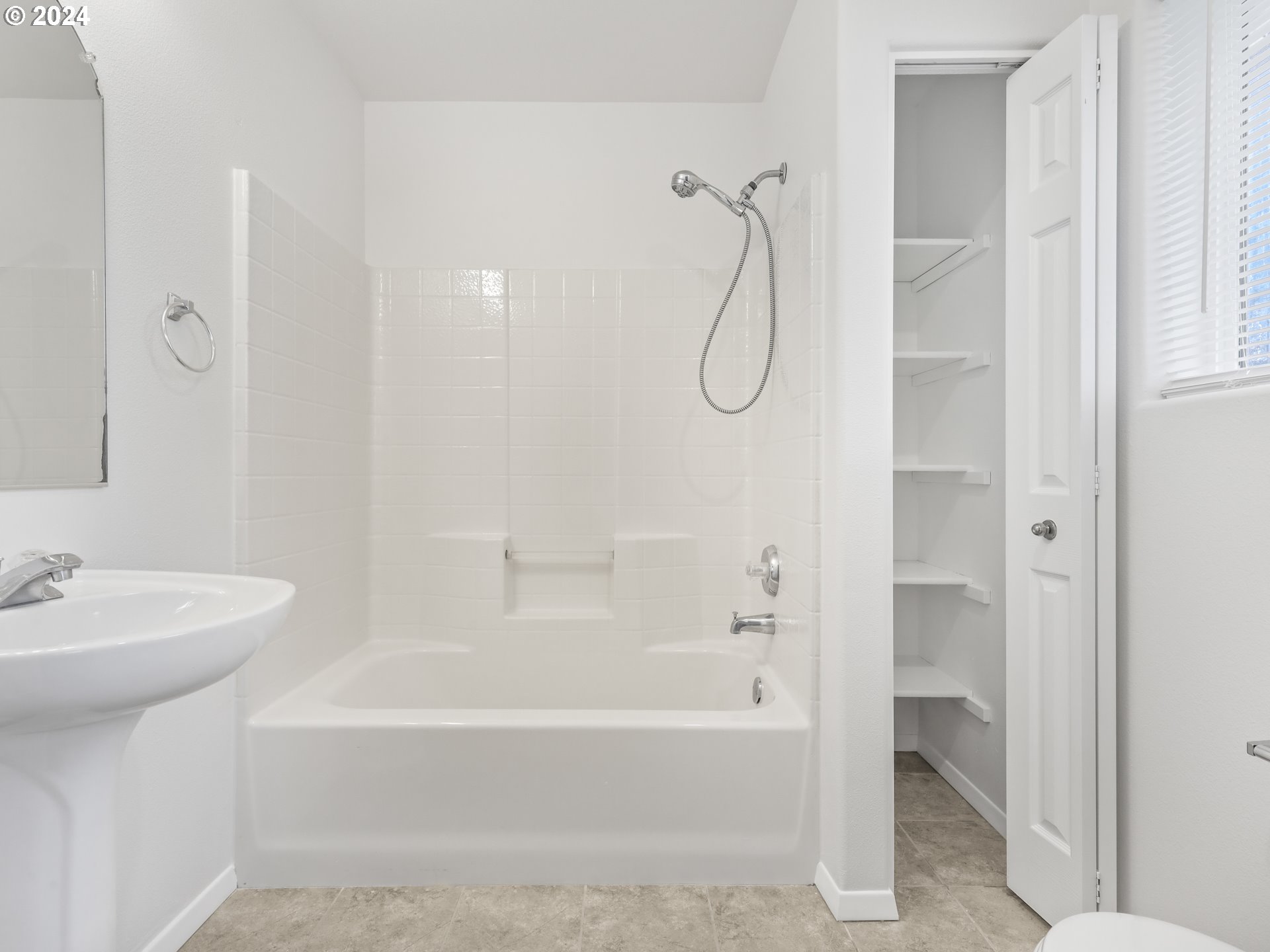 14315 Southwest Cougar Ridge Drive Beaverton, OR 97008 - Photo 13 of 21 a bathroom with a bath tub a sink and a shower