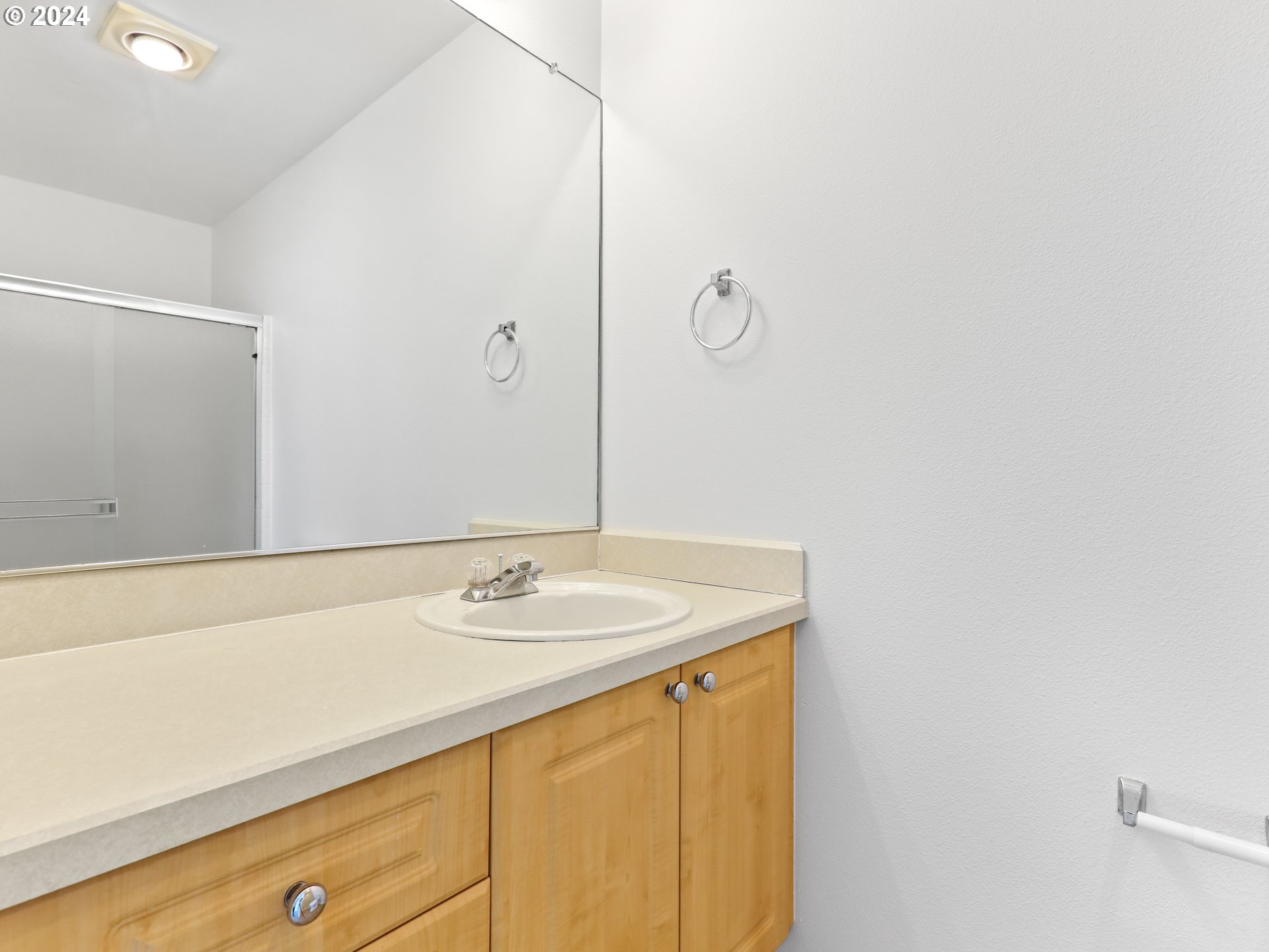 14315 Southwest Cougar Ridge Drive Beaverton, OR 97008 - Photo 14 of 21 a bathroom with a sink and a mirror