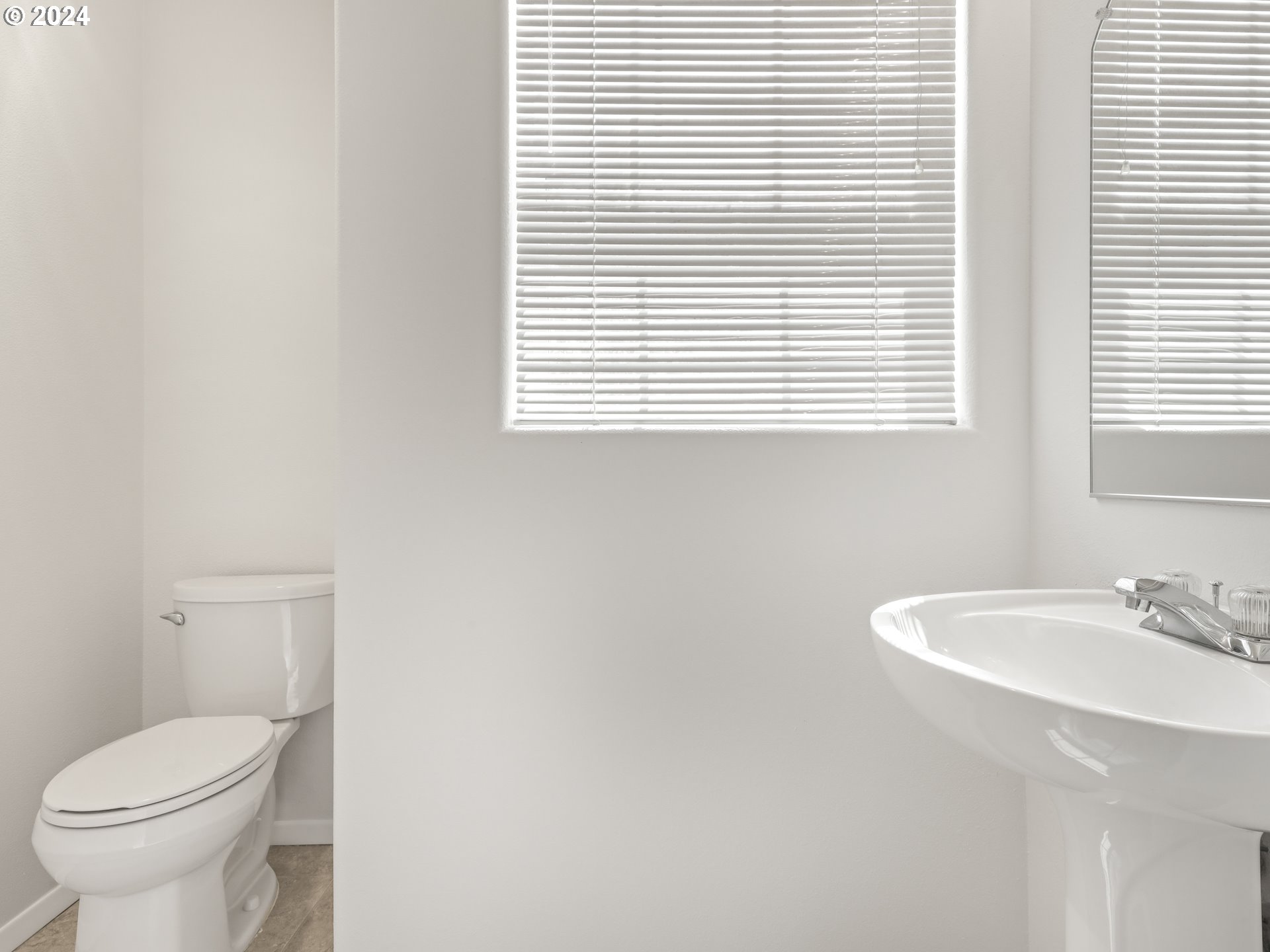 14315 Southwest Cougar Ridge Drive Beaverton, OR 97008 - Photo 15 of 21 a bathroom with a sink a toilet and a window