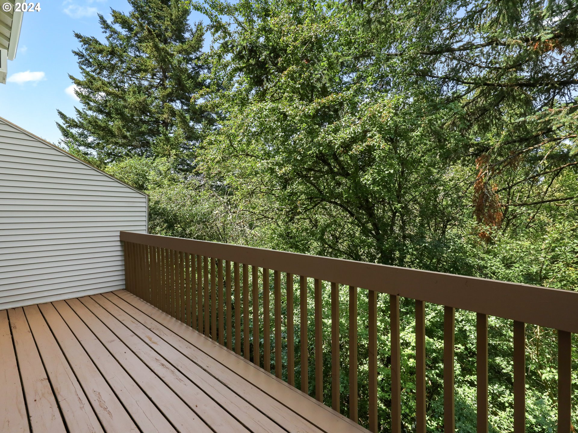 14315 Southwest Cougar Ridge Drive Beaverton, OR 97008 - Photo 17 of 21 a balcony with wooden floor and fence