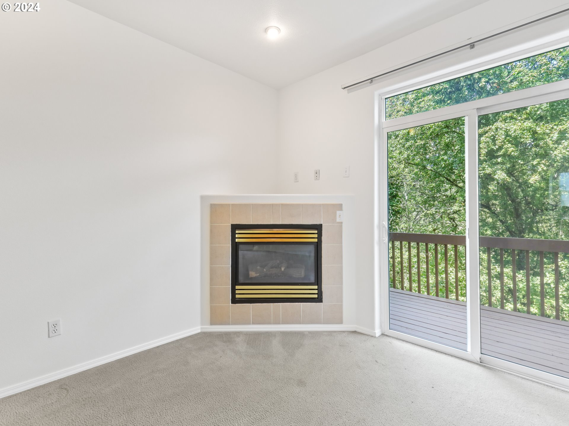 14315 Southwest Cougar Ridge Drive Beaverton, OR 97008 - Photo 3 of 21 a view of an empty room with a window