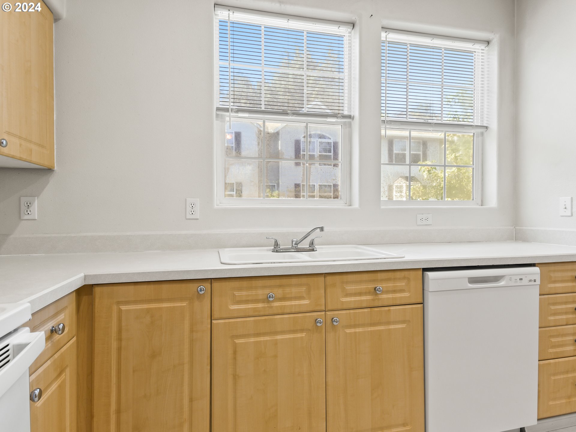 14315 Southwest Cougar Ridge Drive Beaverton, OR 97008 - Photo 7 of 21 a bathroom with a sink and a window