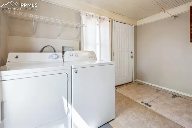 a view of storage and utility room with washer and dryer