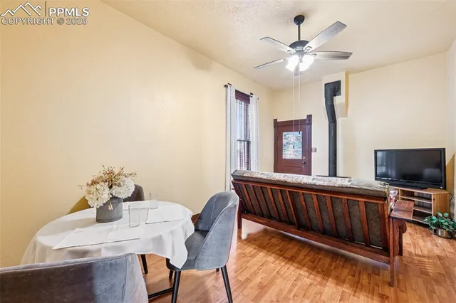 a view of a dining room with furniture wooden floor and chandelier