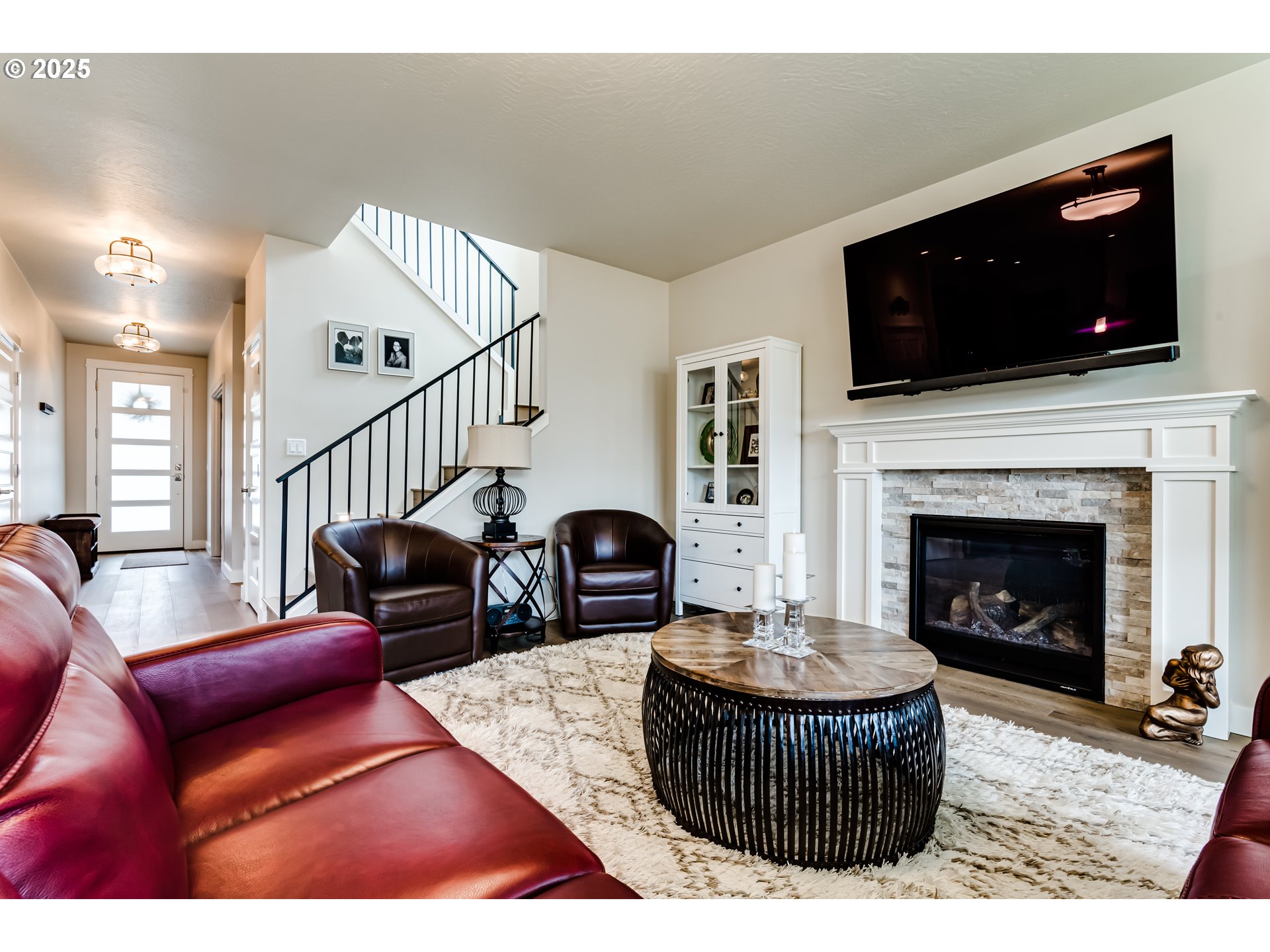 1489 Taylor Street Eugene, OR 97402 - Photo 12 of 47 a living room with furniture a flat screen tv and a fireplace