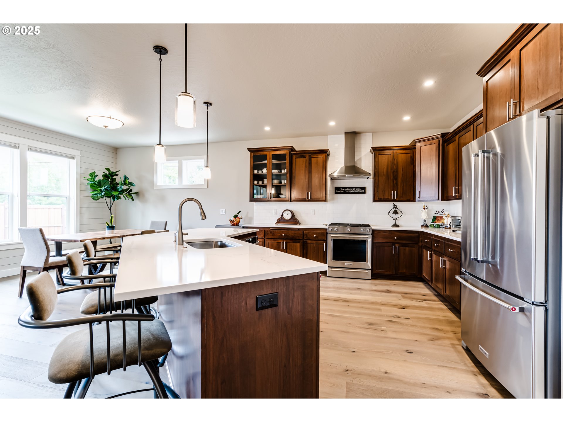 1489 Taylor Street Eugene, OR 97402 - Photo 14 of 47 a kitchen with stainless steel appliances kitchen island granite countertop a sink refrigerator and cabinets