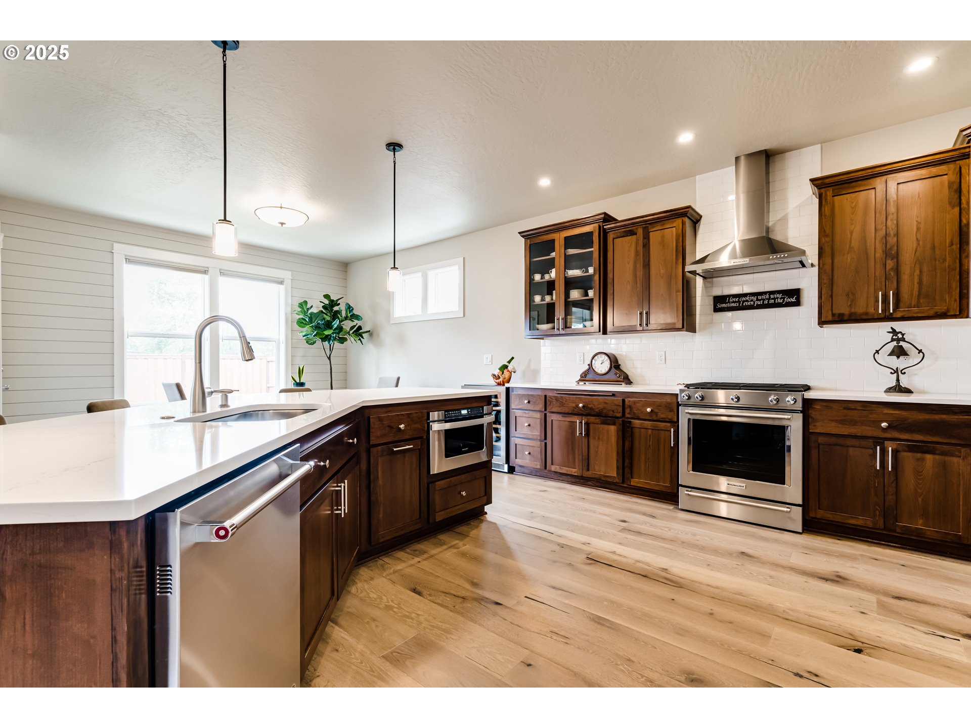 1489 Taylor Street Eugene, OR 97402 - Photo 15 of 47 a kitchen with stainless steel appliances kitchen island granite countertop a sink counter space and cabinets
