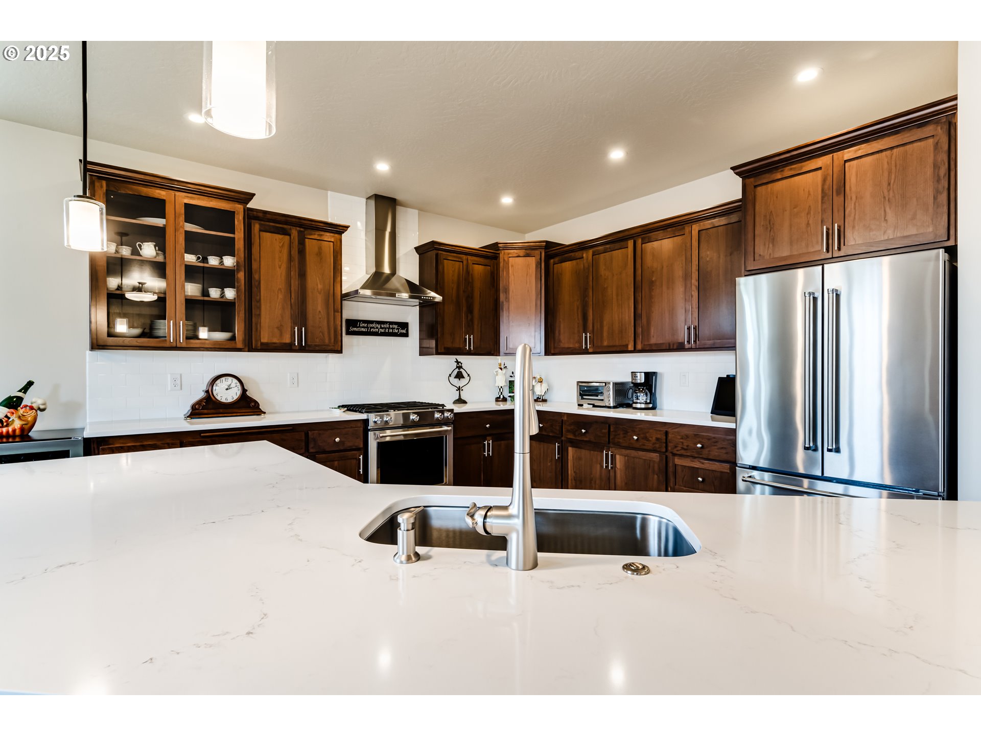 1489 Taylor Street Eugene, OR 97402 - Photo 20 of 47 a kitchen with stainless steel appliances a refrigerator and a sink
