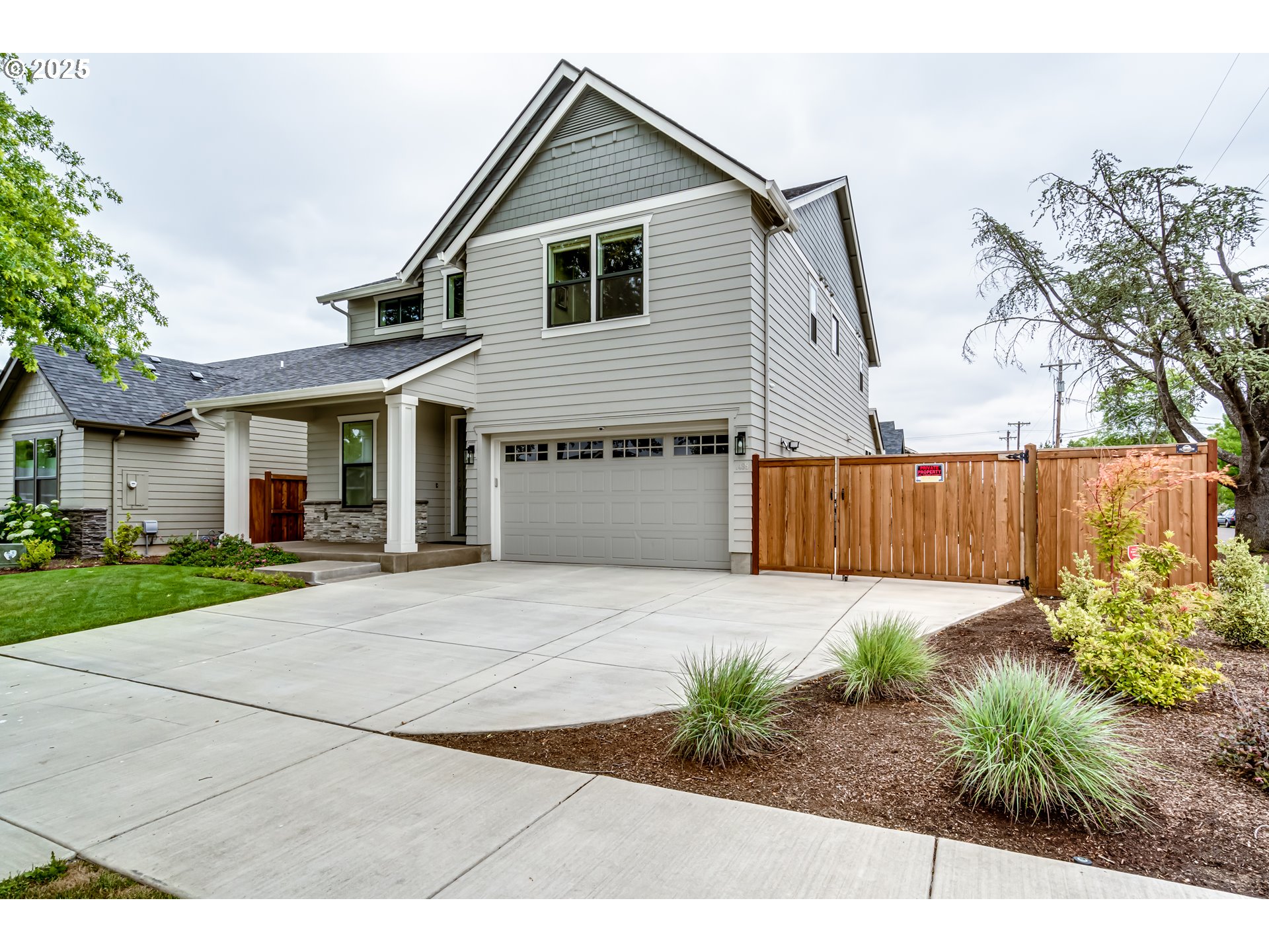 1489 Taylor Street Eugene, OR 97402 - Photo 2 of 47 a front view of a house with a yard and garage