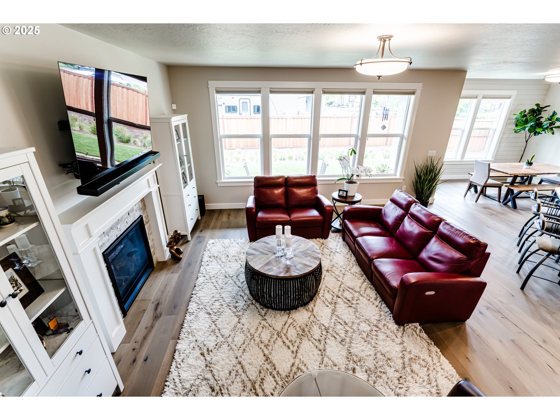1489 Taylor Street Eugene, OR 97402 - Photo 22 of 47 a living room with furniture a flat screen tv and a fireplace