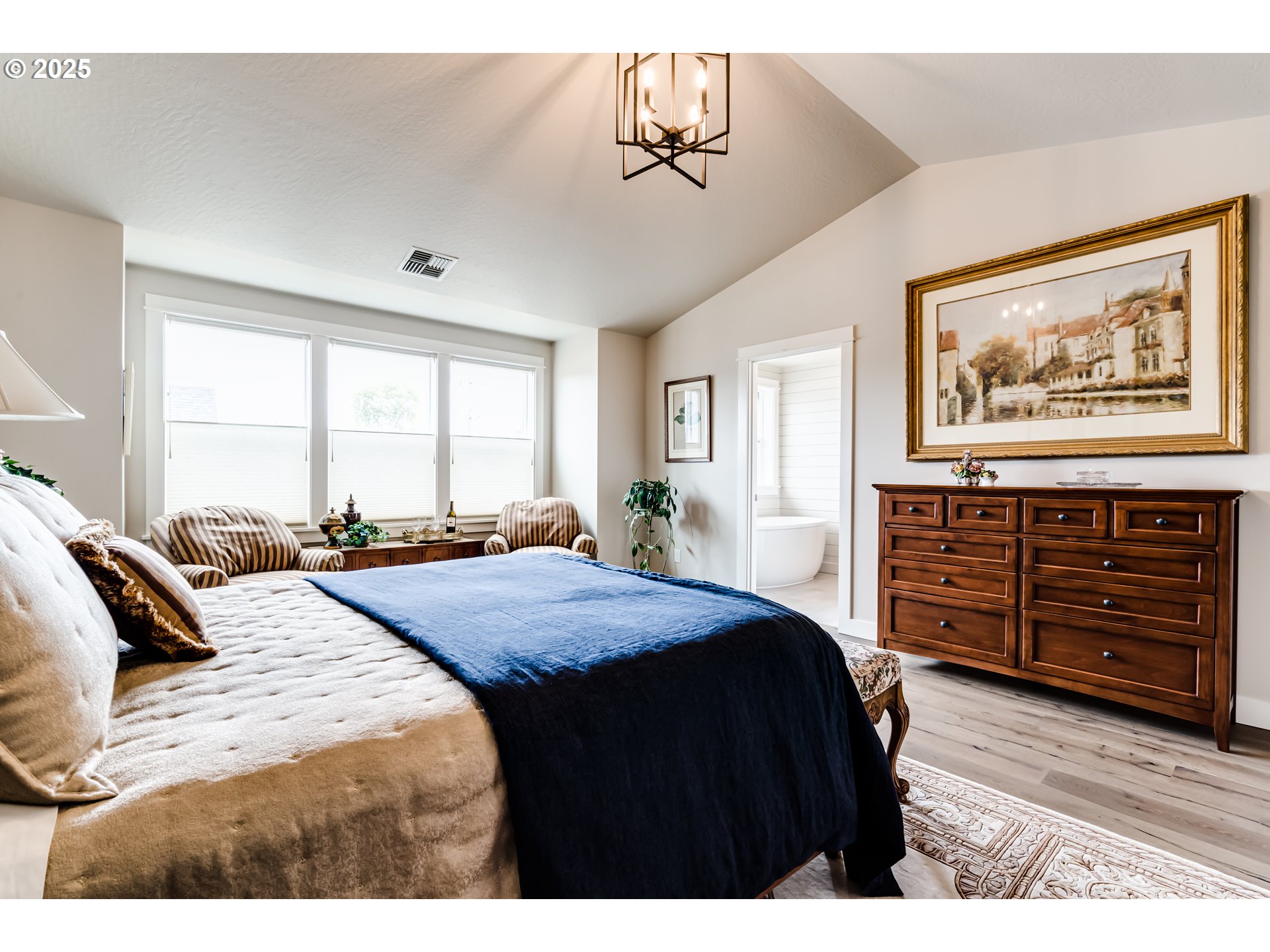 1489 Taylor Street Eugene, OR 97402 - Photo 28 of 47 a bedroom with a bed a dresser and wooden floor
