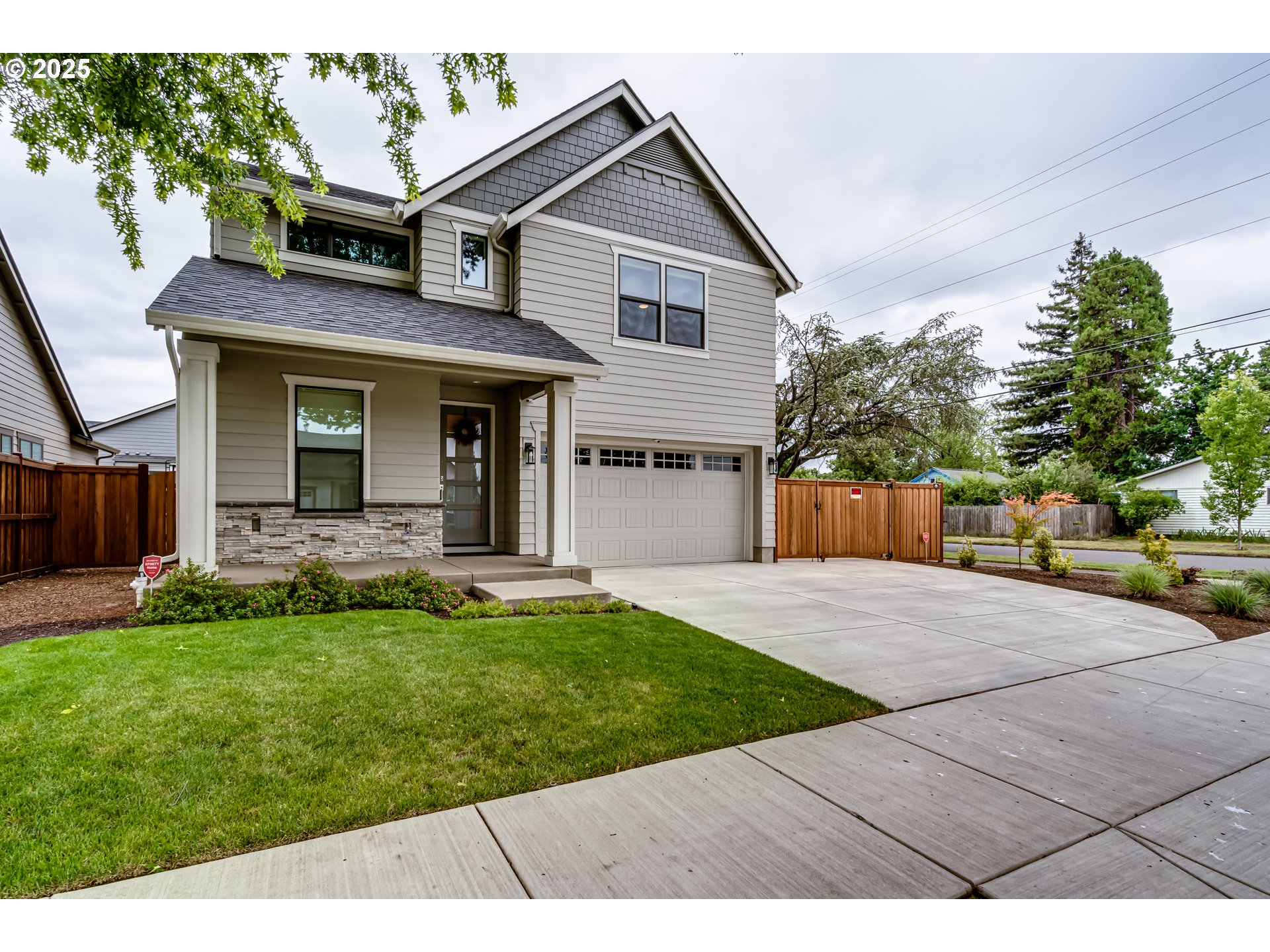 1489 Taylor Street Eugene, OR 97402 - Photo 3 of 47 a front view of a house with a yard and garage