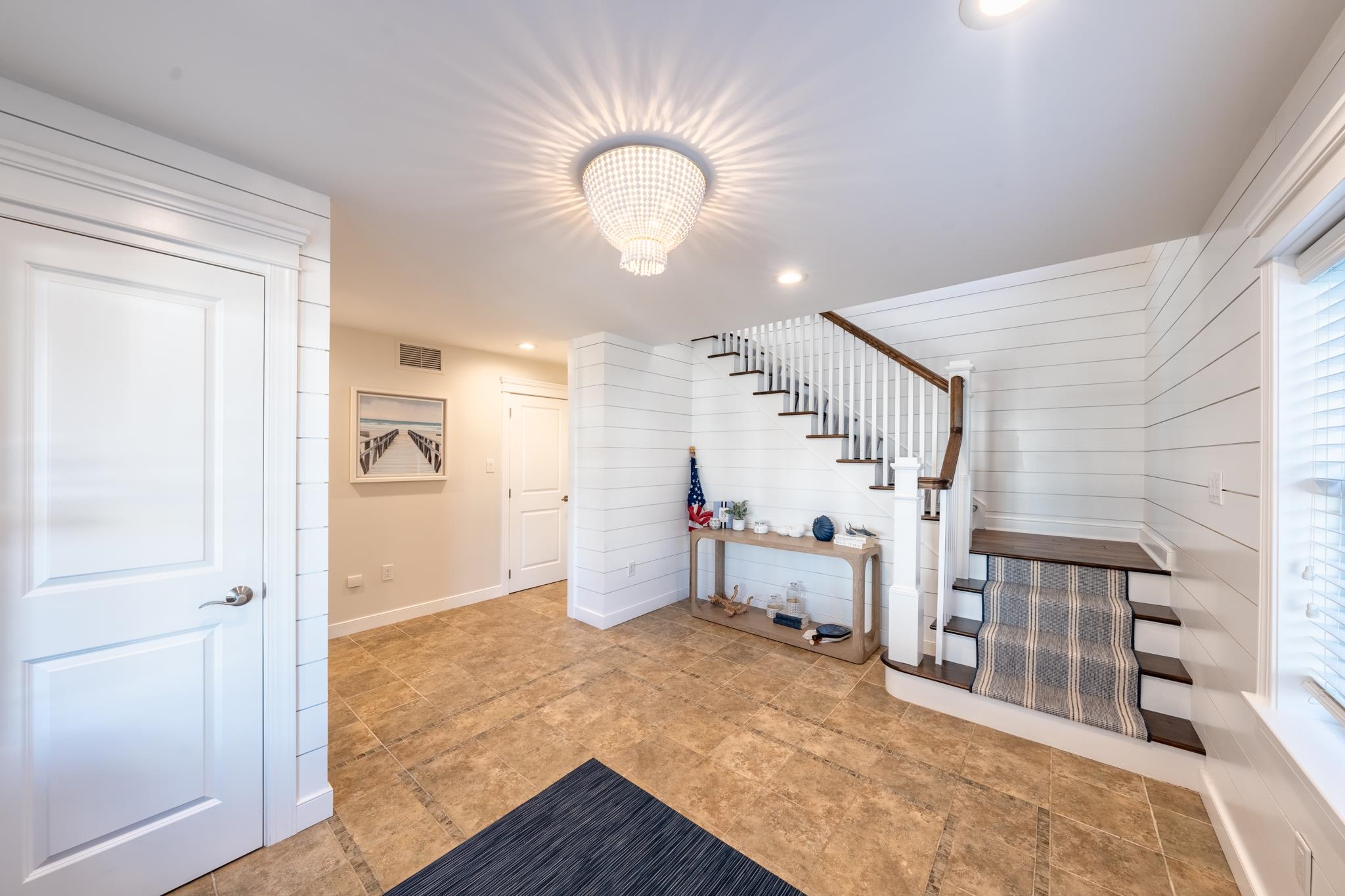 40 13th Street East Avalon, NJ 08202 - Photo 12 of 40 a view of a livingroom with wooden floor and staircase