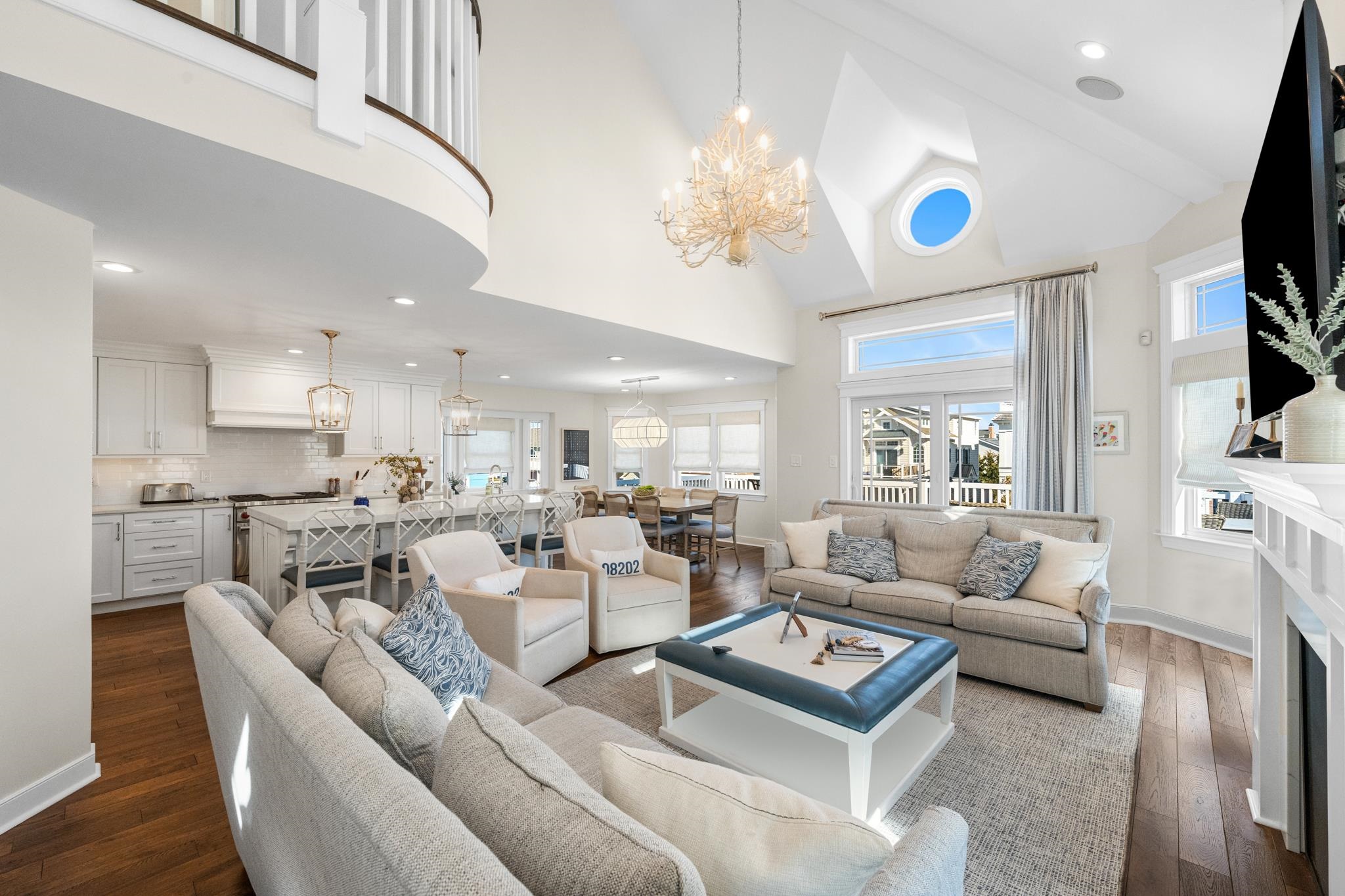 40 13th Street East Avalon, NJ 08202 - Photo 14 of 40 a living room with furniture a chandelier and a flat screen tv