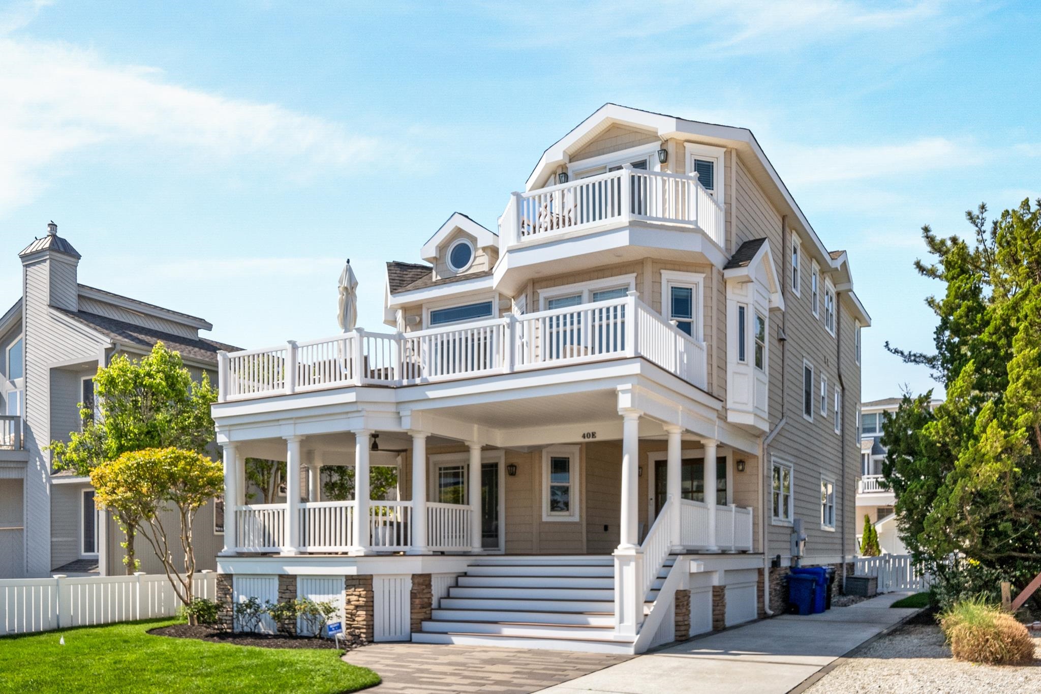 40 13th Street East Avalon, NJ 08202 - Photo 2 of 40 a front view of a house with a yard