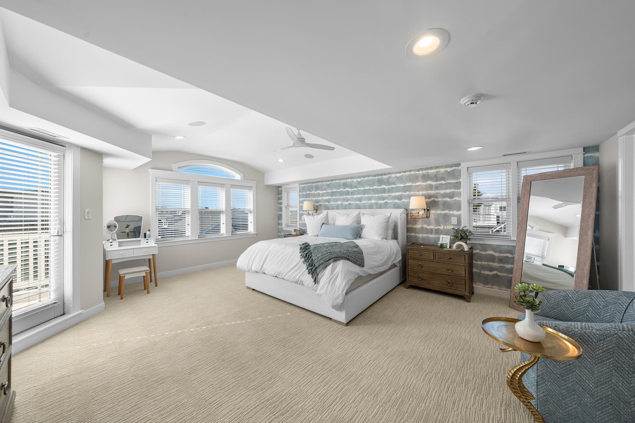 40 13th Street East Avalon, NJ 08202 - Photo 27 of 40 a spacious bedroom with a bed and large window