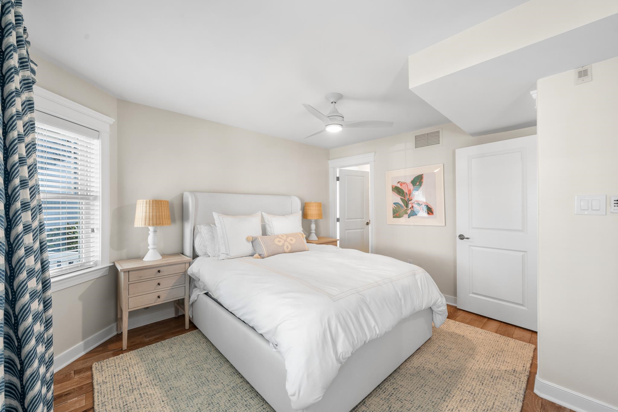 40 13th Street East Avalon, NJ 08202 - Photo 32 of 40 a bedroom with a bed and a lamp