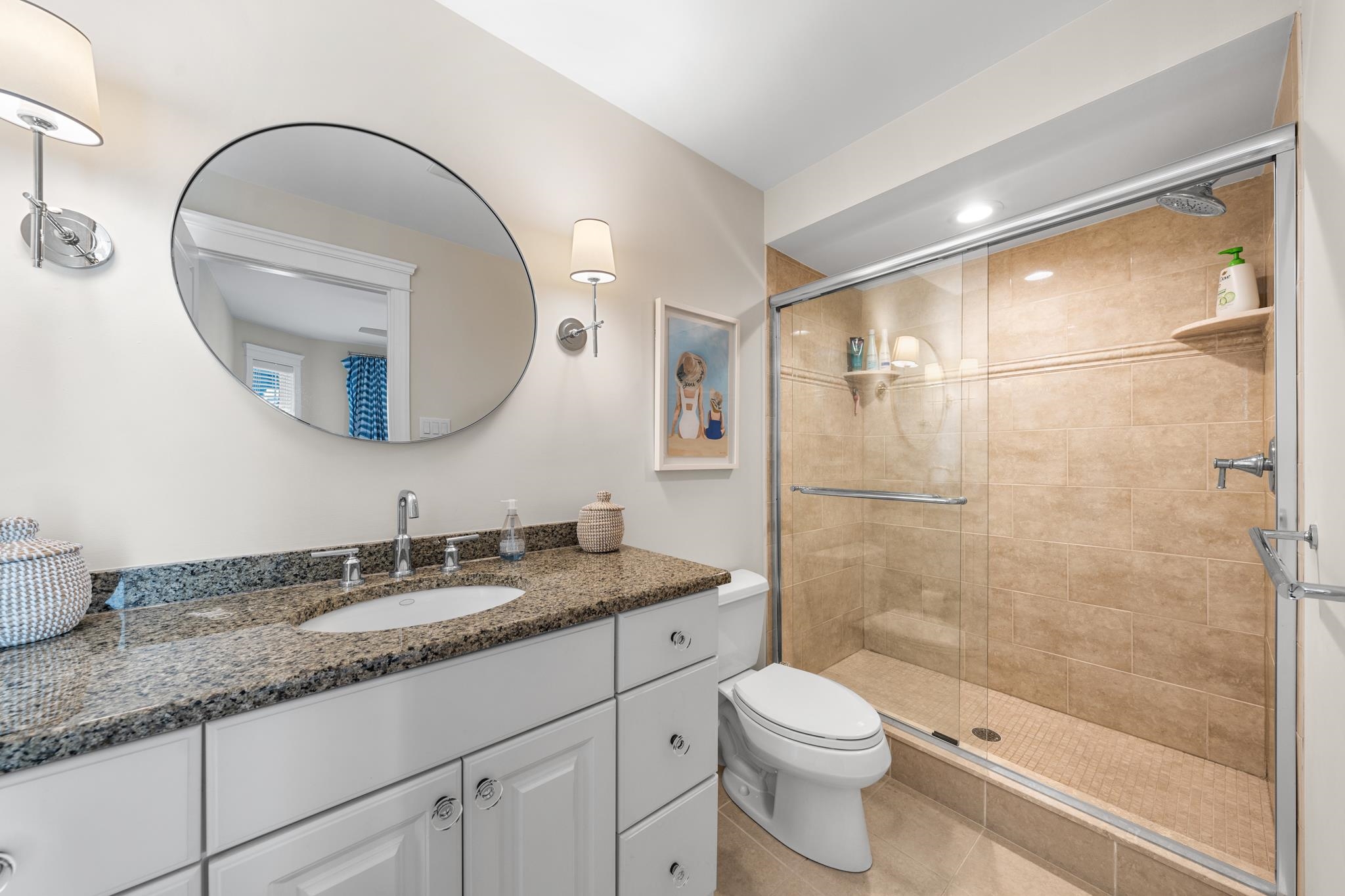 40 13th Street East Avalon, NJ 08202 - Photo 33 of 40 a bathroom with a granite countertop sink a toilet and shower