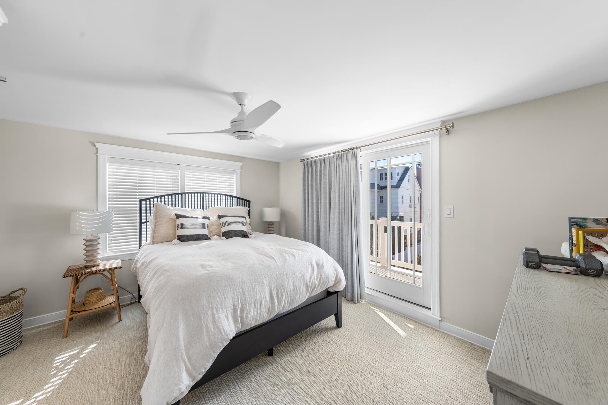 40 13th Street East Avalon, NJ 08202 - Photo 36 of 40 a bedroom with a bed and a large window