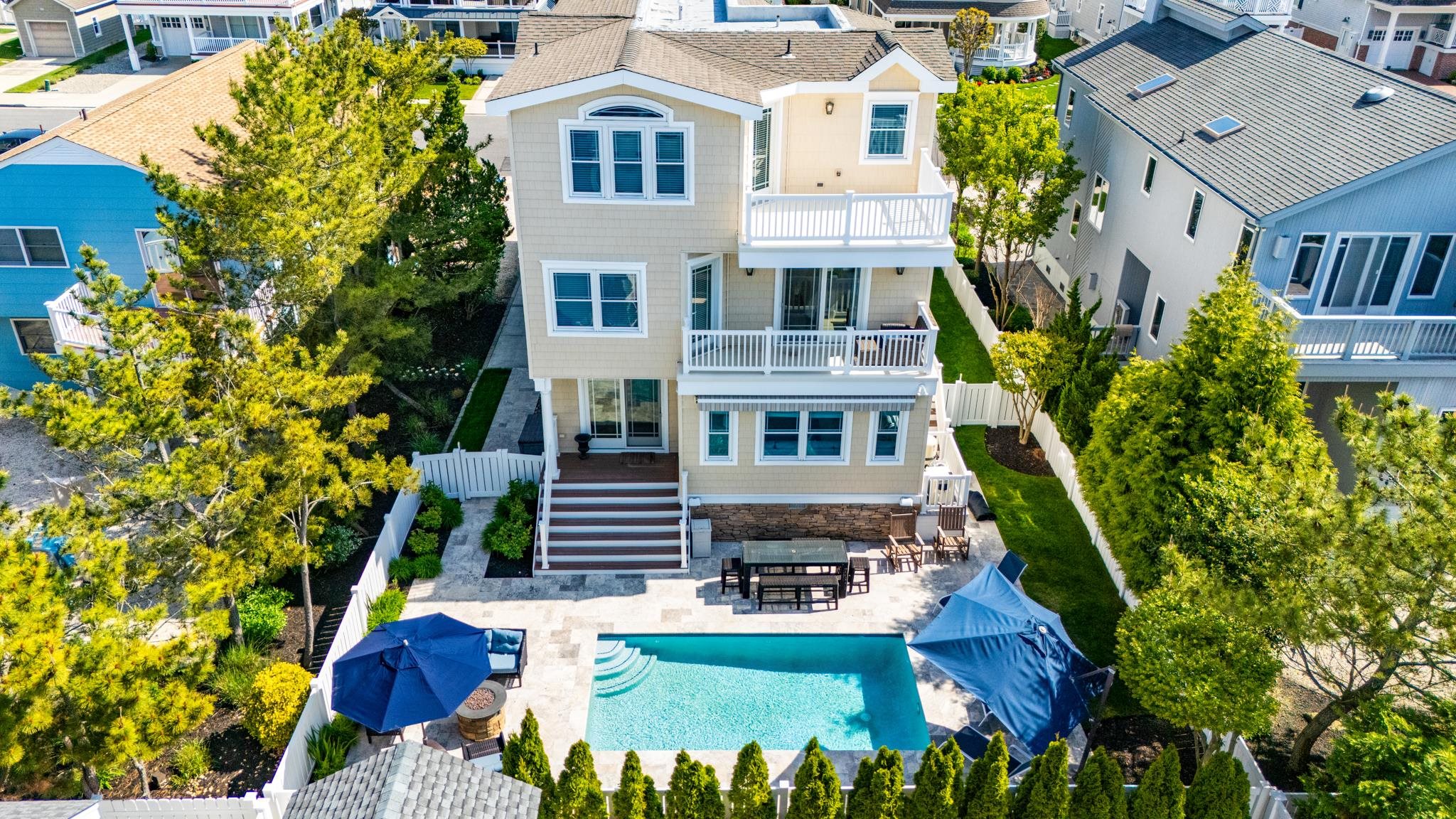 40 13th Street East Avalon, NJ 08202 - Photo 7 of 40 an aerial view of multiple houses with a yard