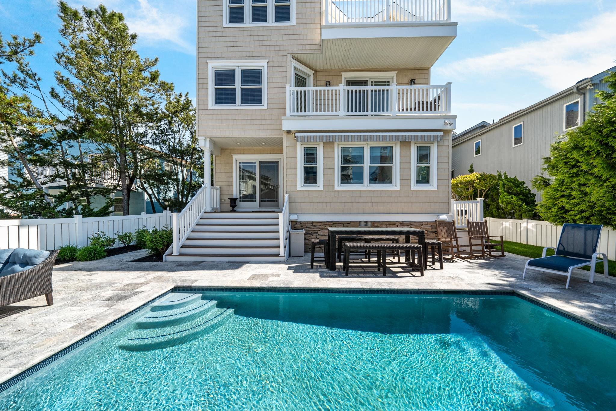 40 13th Street East Avalon, NJ 08202 - Photo 8 of 40 a view of house with swimming pool and sitting area