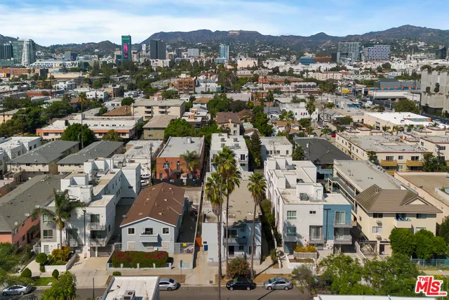 an aerial view of a city with lots of residential buildings