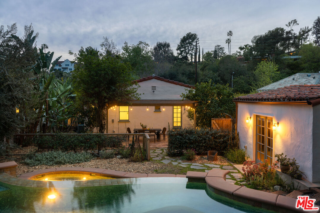 1200 Avenue 64 Pasadena, CA 91105 - Photo 1 of 62 a view of a house with swimming pool and sitting area