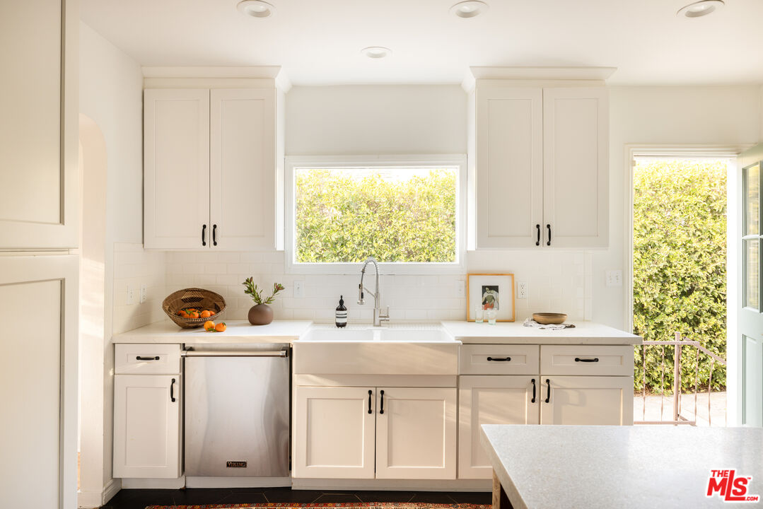 1200 Avenue 64 Pasadena, CA 91105 - Photo 18 of 62 a bathroom with a sink vanity granite tub and a mirror