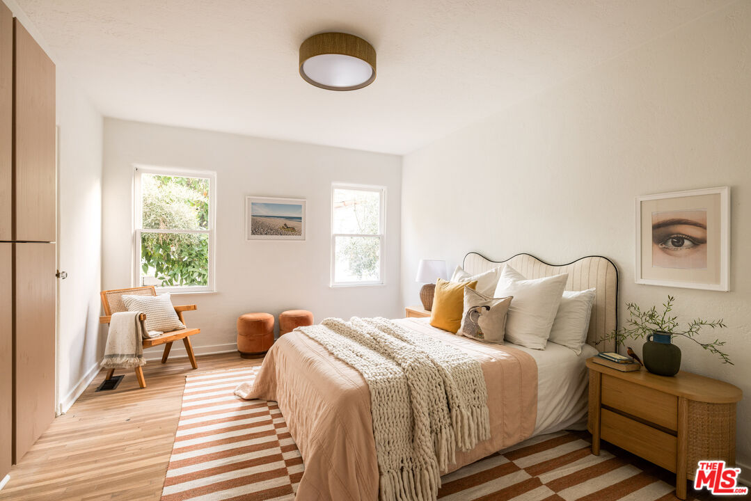 1200 Avenue 64 Pasadena, CA 91105 - Photo 23 of 62 a bedroom with a bed and wooden floor