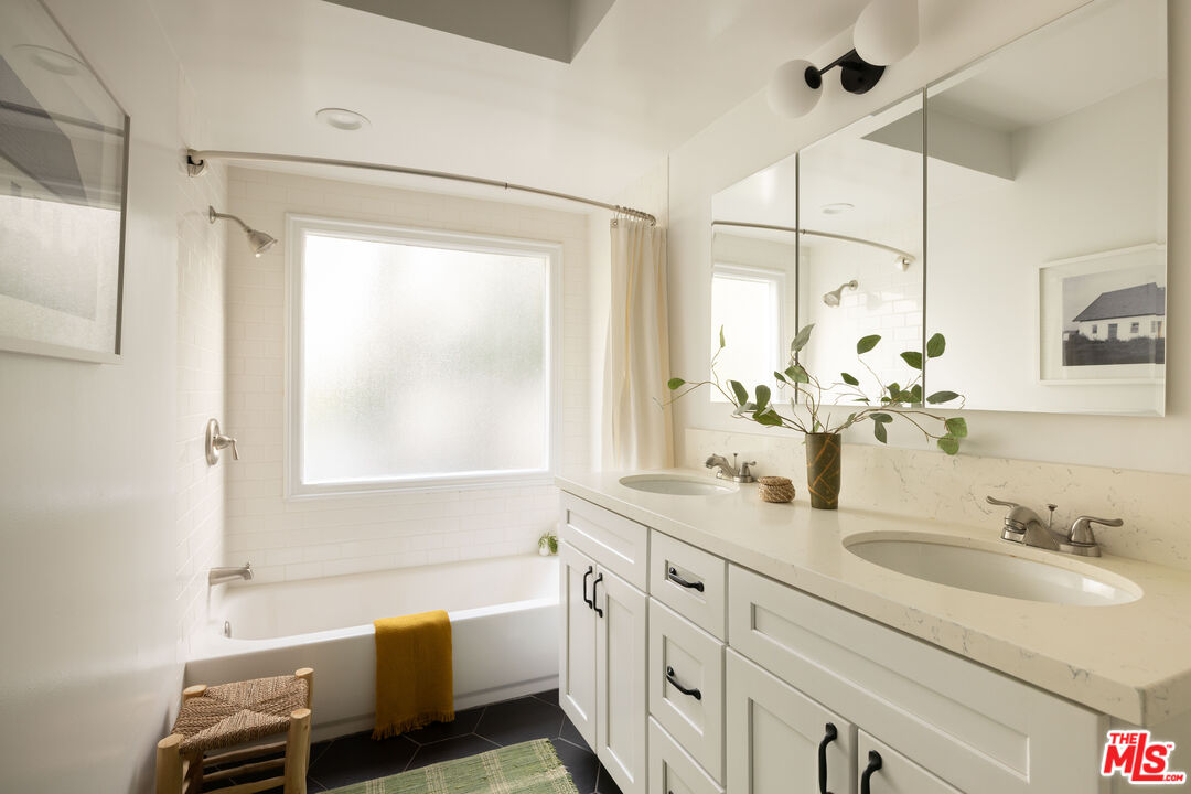 1200 Avenue 64 Pasadena, CA 91105 - Photo 26 of 62 a bathroom with a granite countertop sink mirror vanity and a bathtub