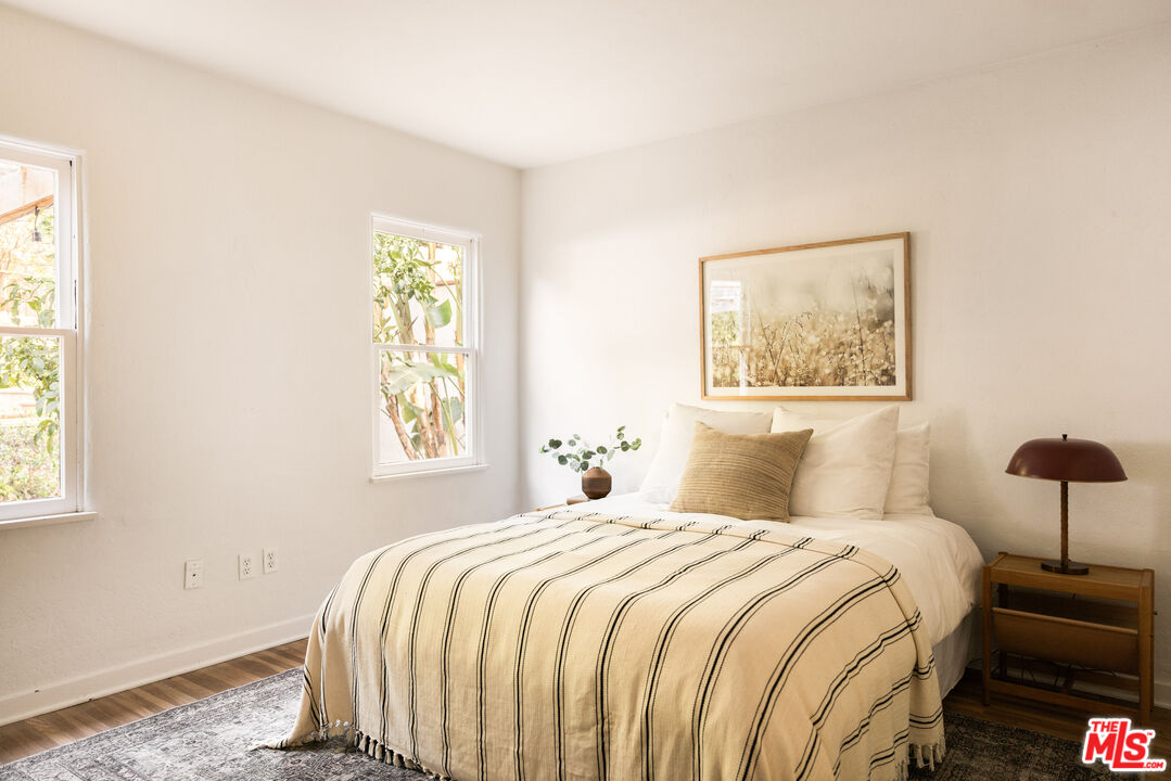 1200 Avenue 64 Pasadena, CA 91105 - Photo 28 of 62 a bedroom with a bed and a painting on the wall