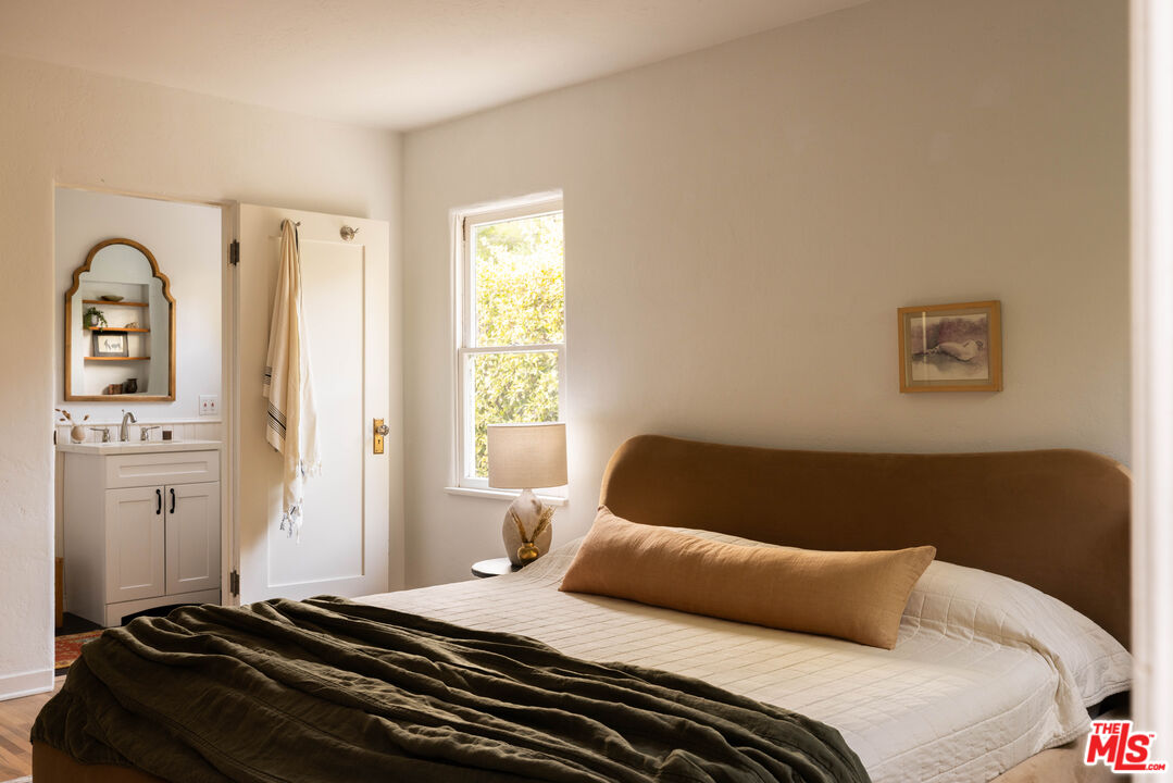 1200 Avenue 64 Pasadena, CA 91105 - Photo 31 of 62 a bedroom with a bed and wooden floor