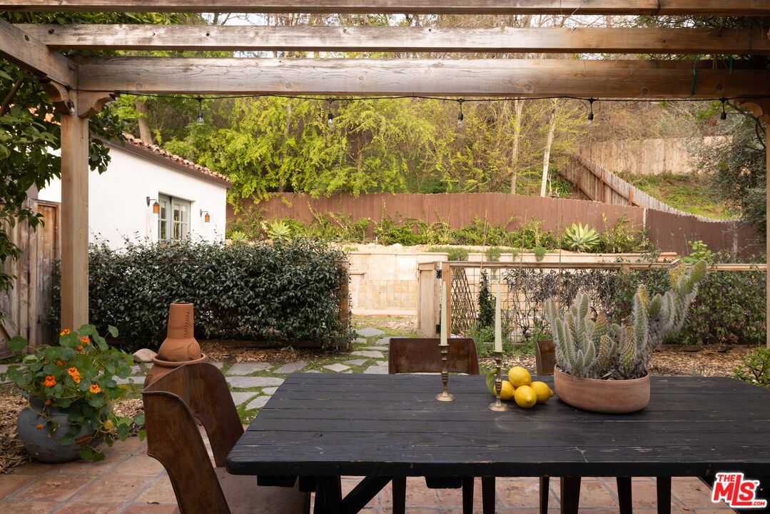 1200 Avenue 64 Pasadena, CA 91105 - Photo 37 of 62 a view of a dining room with furniture and a potted plant