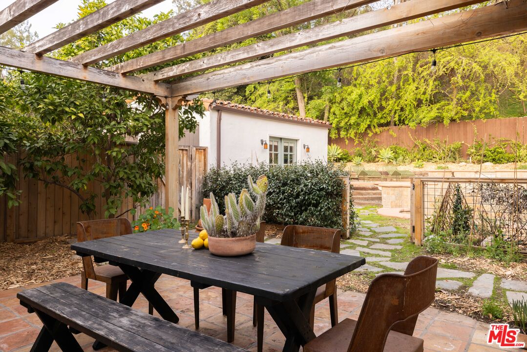 1200 Avenue 64 Pasadena, CA 91105 - Photo 38 of 62 a view of a patio with table and chairs and potted plants