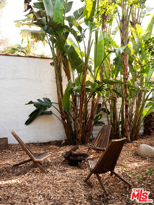 1200 Avenue 64 Pasadena, CA 91105 - Photo 39 of 62 a vase of flowers sitting on a table