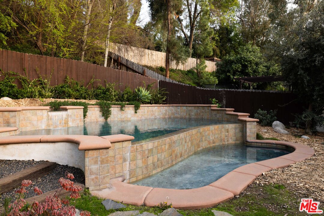 1200 Avenue 64 Pasadena, CA 91105 - Photo 42 of 62 a view of a swimming pool with a patio